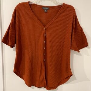 Orange button up top